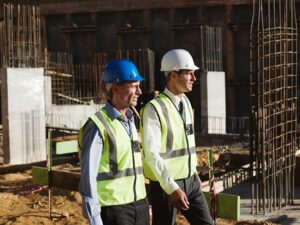 Mature men walking on construction site